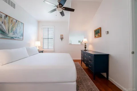 a bedroom with a bed dresser and a window