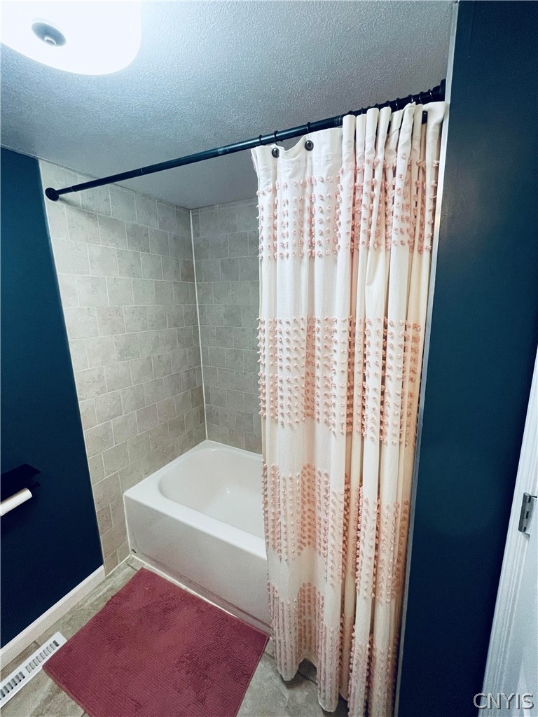 4982 Aitchison Road Onondaga, NY 13215 - Photo 9 of 26 Main Hall Bath tub with shower