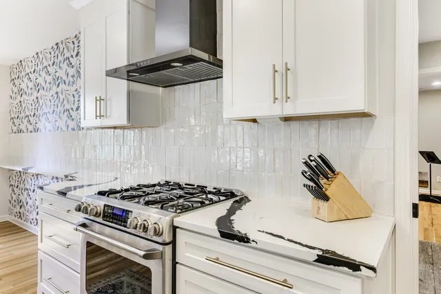 a bathroom with a sink a toilet a mirror and shower curtain