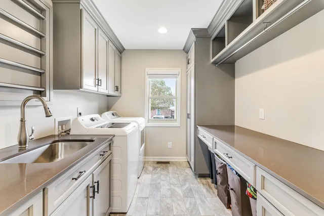 a view of a patio with a table and chairs under an umbrella