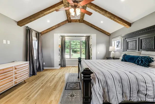 a view of a patio with a table chairs and a backyard