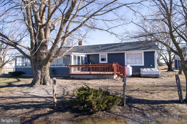 a kitchen with stainless steel appliances a sink a stove a refrigerator and cabinets