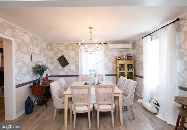 a room with a walk in closet and wooden floor