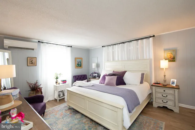 a living room with lots of furniture and a large window