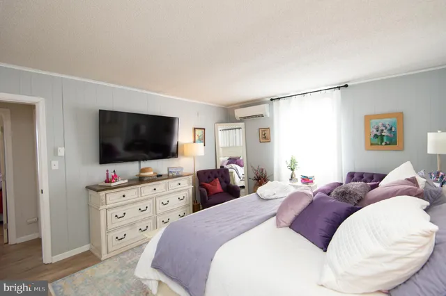 a living room with furniture and a dining table