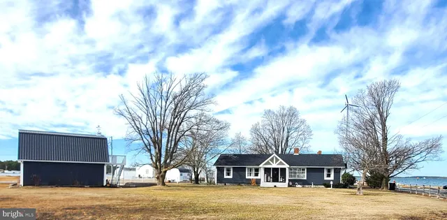an aerial view of a house with outdoor space