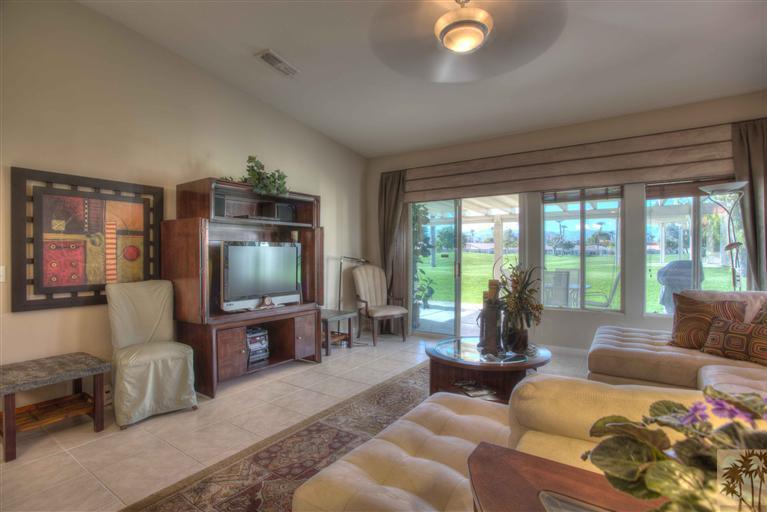 49121 Biery Street Indio, CA 92201 - Photo 14 of 25 a living room with furniture and a flat screen tv