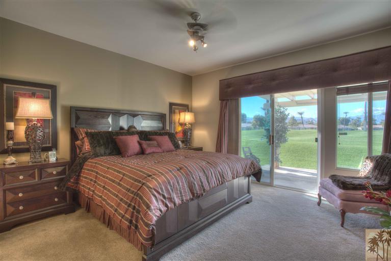 49121 Biery Street Indio, CA 92201 - Photo 15 of 25 a bedroom with a bed and large glass window