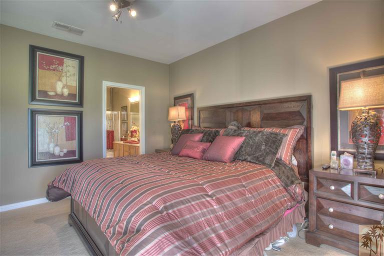49121 Biery Street Indio, CA 92201 - Photo 16 of 25 a bedroom with a large bed and a tv