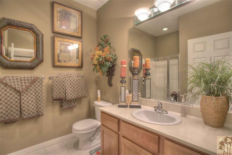 49121 Biery Street Indio, CA 92201 - Photo 18 of 25 a bathroom with a toilet sink and mirror