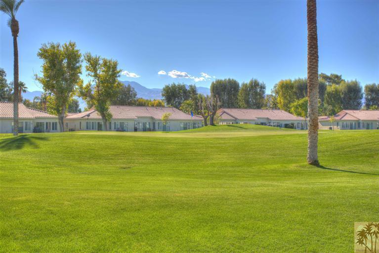 49121 Biery Street Indio, CA 92201 - Photo 3 of 25 a view of a swimming pool with an outdoor space and seating area