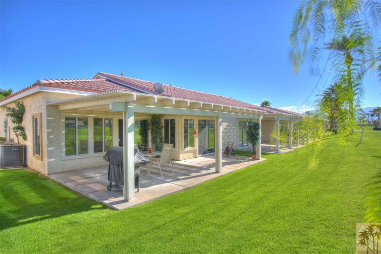 49121 Biery Street Indio, CA 92201 - Photo 22 of 25 a front view of a house with a yard and porch