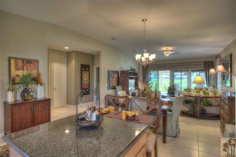 49121 Biery Street Indio, CA 92201 - Photo 8 of 25 a room with lots of tables a large window and chairs