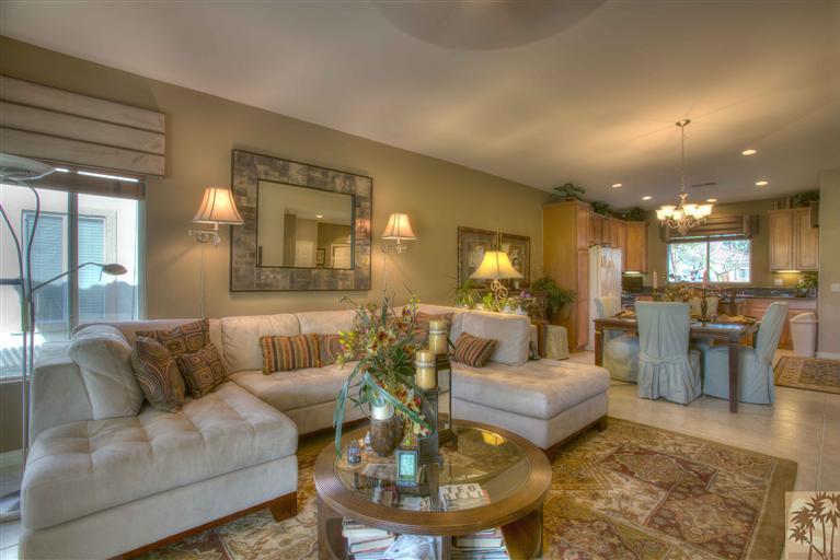 49121 Biery Street Indio, CA 92201 - Photo 10 of 25 a living room with furniture and a dining table with kitchen view