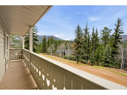 a view of balcony and yard