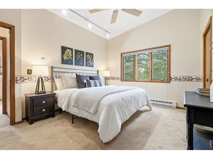 a bedroom with a bed and a table