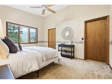 a bedroom with a bed and a table