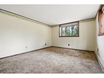 a view of an empty room with windows