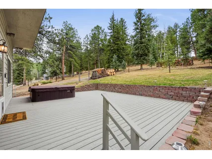 a view of a backyard with sitting area