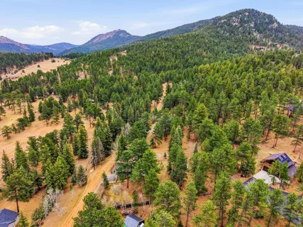 a view of a lush green hillside and a building