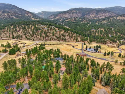 a view of a town with mountains in the background
