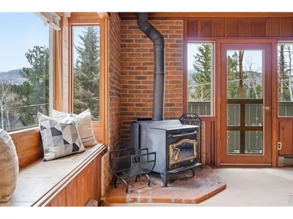 a view of living room filled with furniture and a fireplace