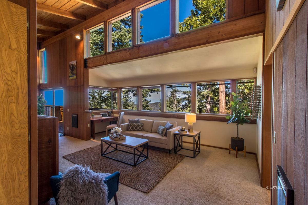 a balcony with furniture and a potted plant