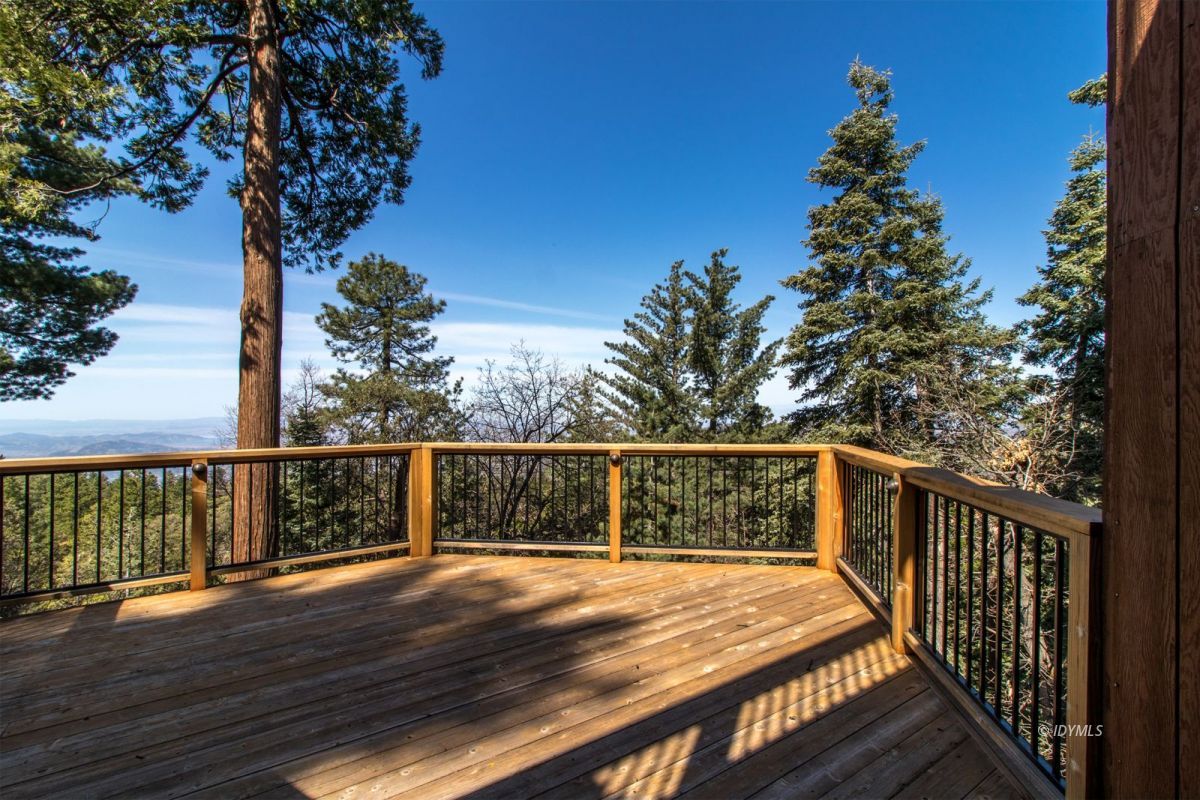 25281 Deer Path Road Pine Cove, CA 92549 - Photo 13 of 42 a view of balcony with wooden floor and fence