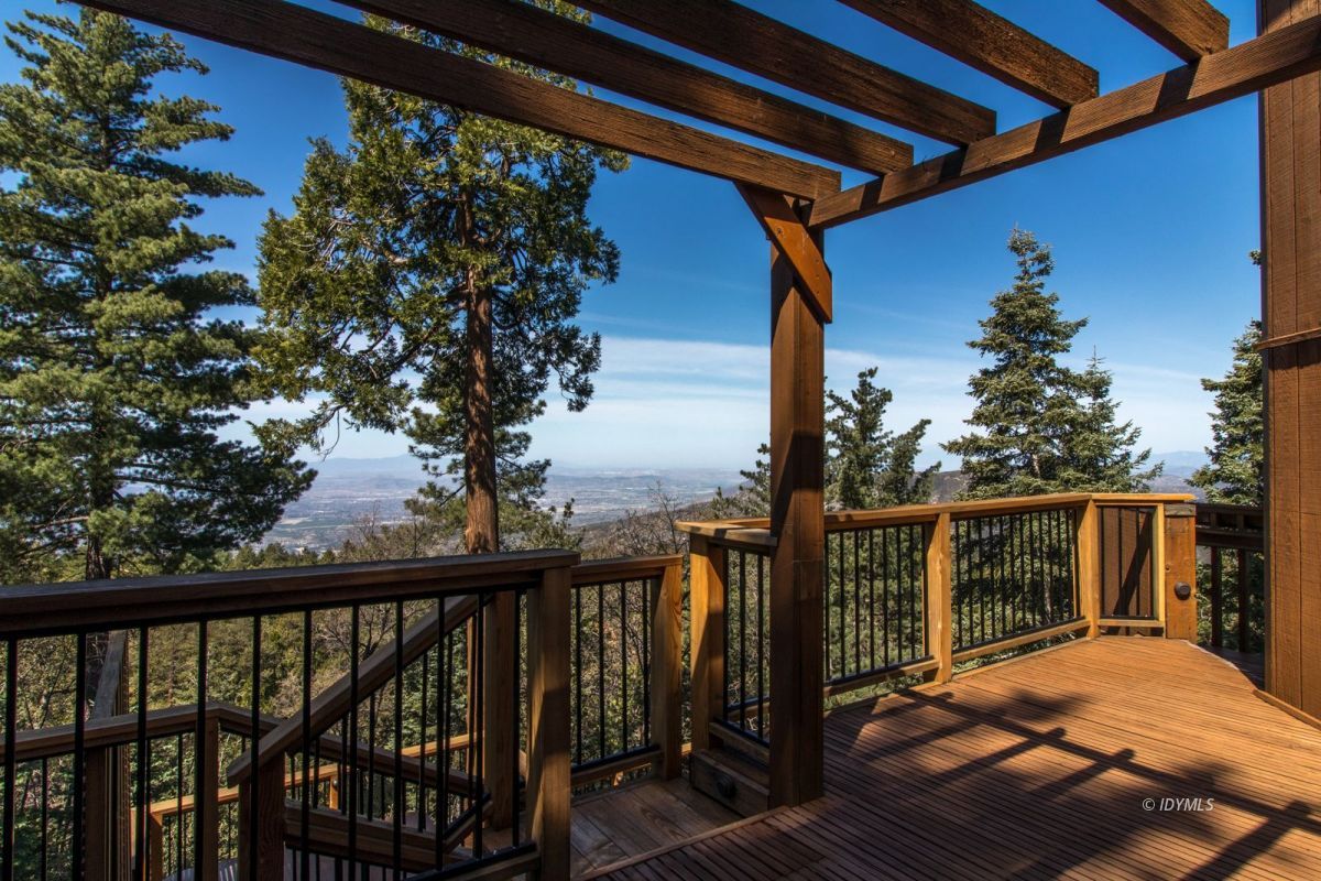 25281 Deer Path Road Pine Cove, CA 92549 - Photo 16 of 42 a view of balcony with wooden floor and fence