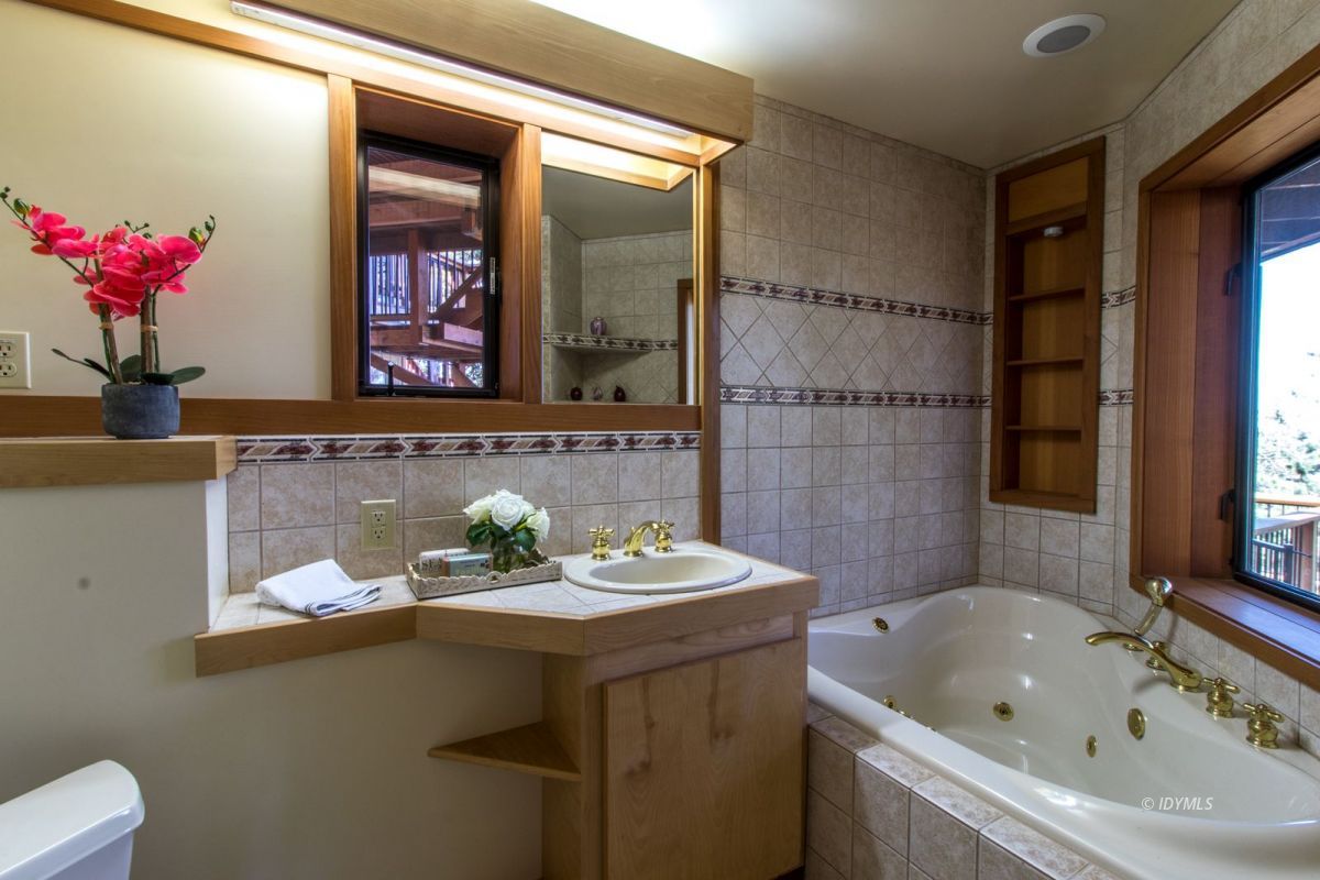 25281 Deer Path Road Pine Cove, CA 92549 - Photo 23 of 42 a bathroom with a sink and a mirror