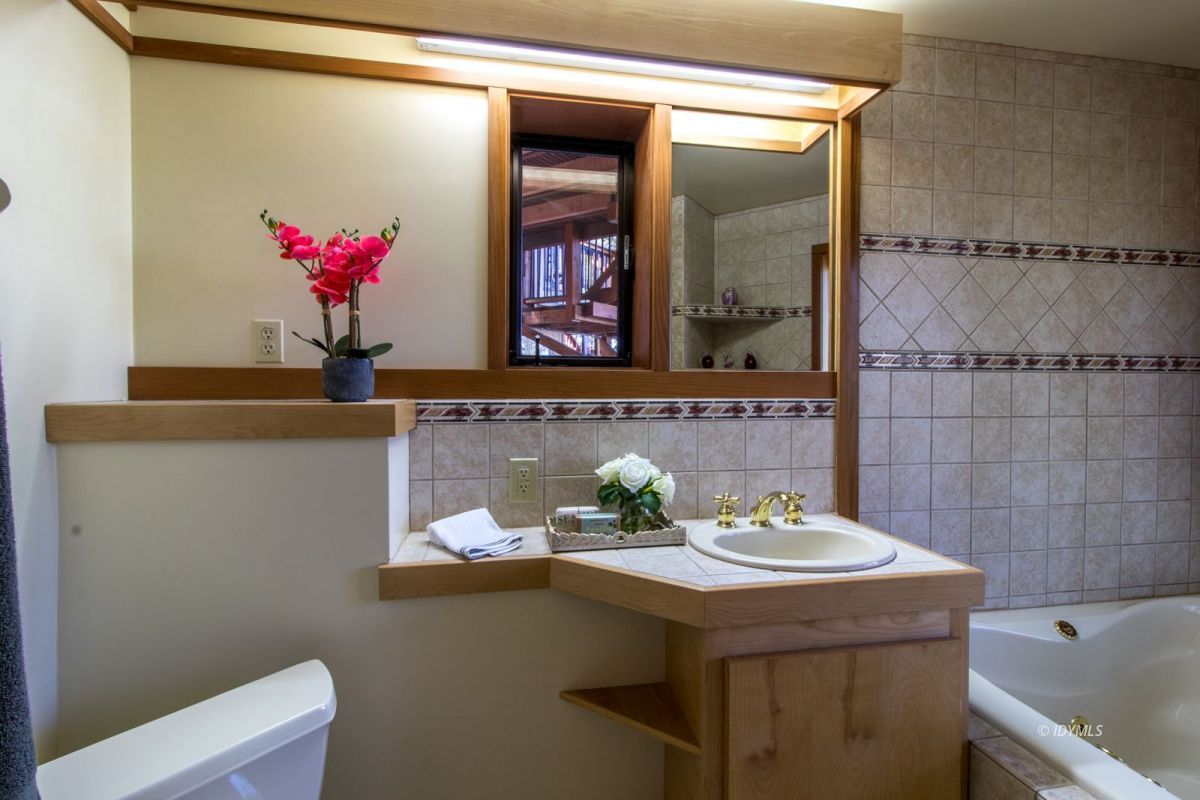 25281 Deer Path Road Pine Cove, CA 92549 - Photo 25 of 42 a bathroom with a sink and a mirror