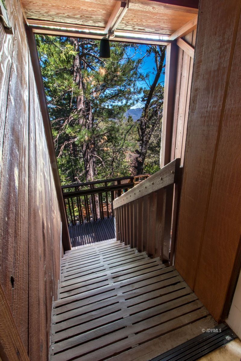 25281 Deer Path Road Pine Cove, CA 92549 - Photo 35 of 42 a view of a balcony with wooden floor