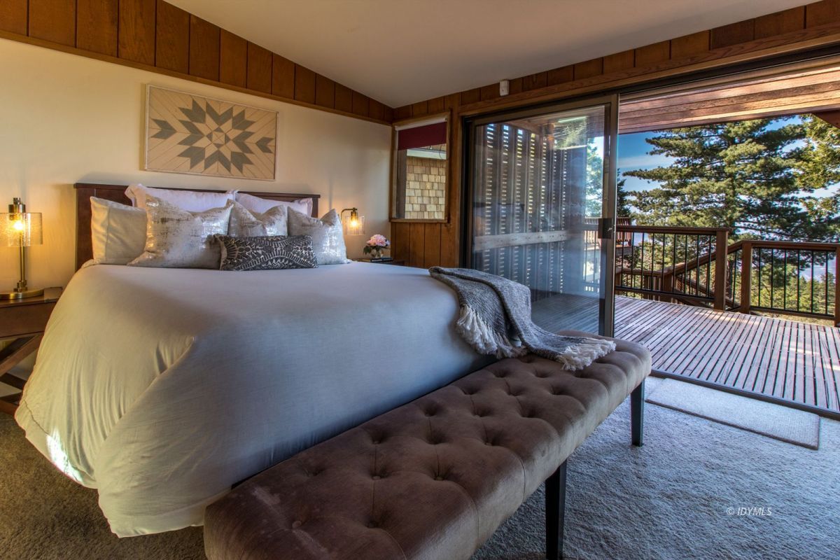 25281 Deer Path Road Pine Cove, CA 92549 - Photo 8 of 42 a bedroom with a bed and a large window