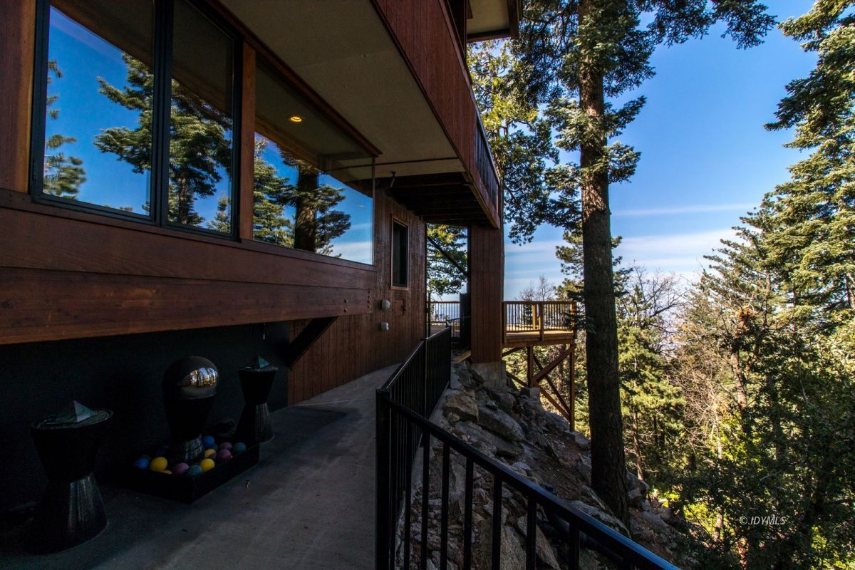 25281 Deer Path Road Pine Cove, CA 92549 - Photo 10 of 42 a view of a balcony with a tree