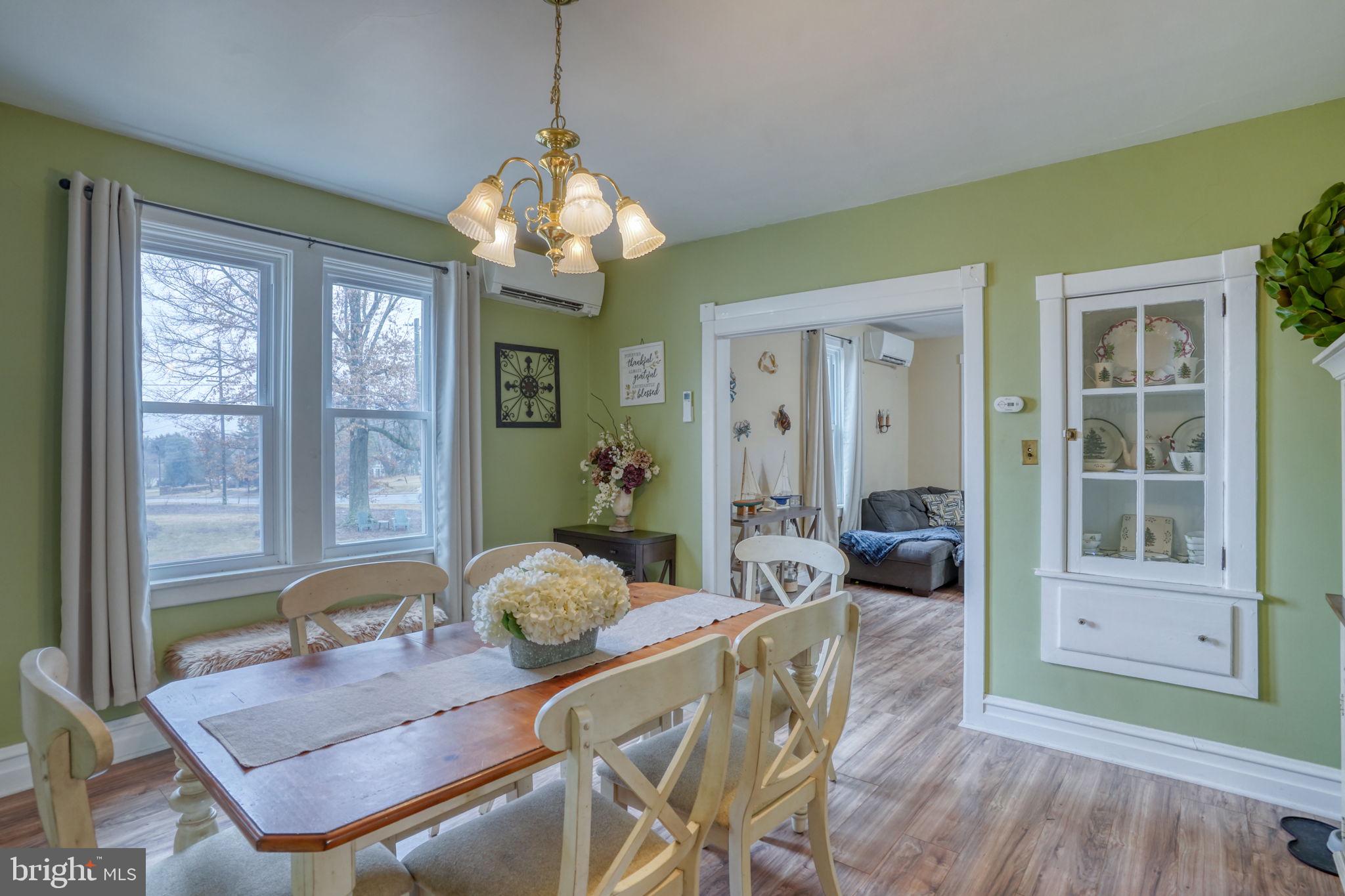 7 Patterson Avenue Perryville, MD 21903 - Photo 14 of 44 a living room with furniture a window and a chandelier