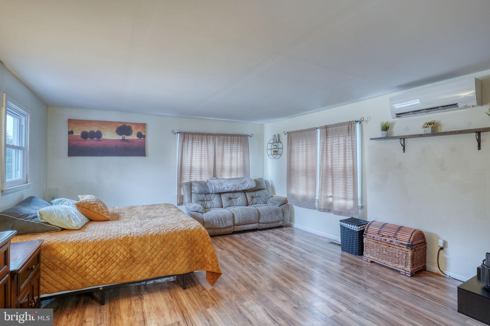 7 Patterson Avenue Perryville, MD 21903 - Photo 22 of 44 a bedroom with furniture and wooden floor