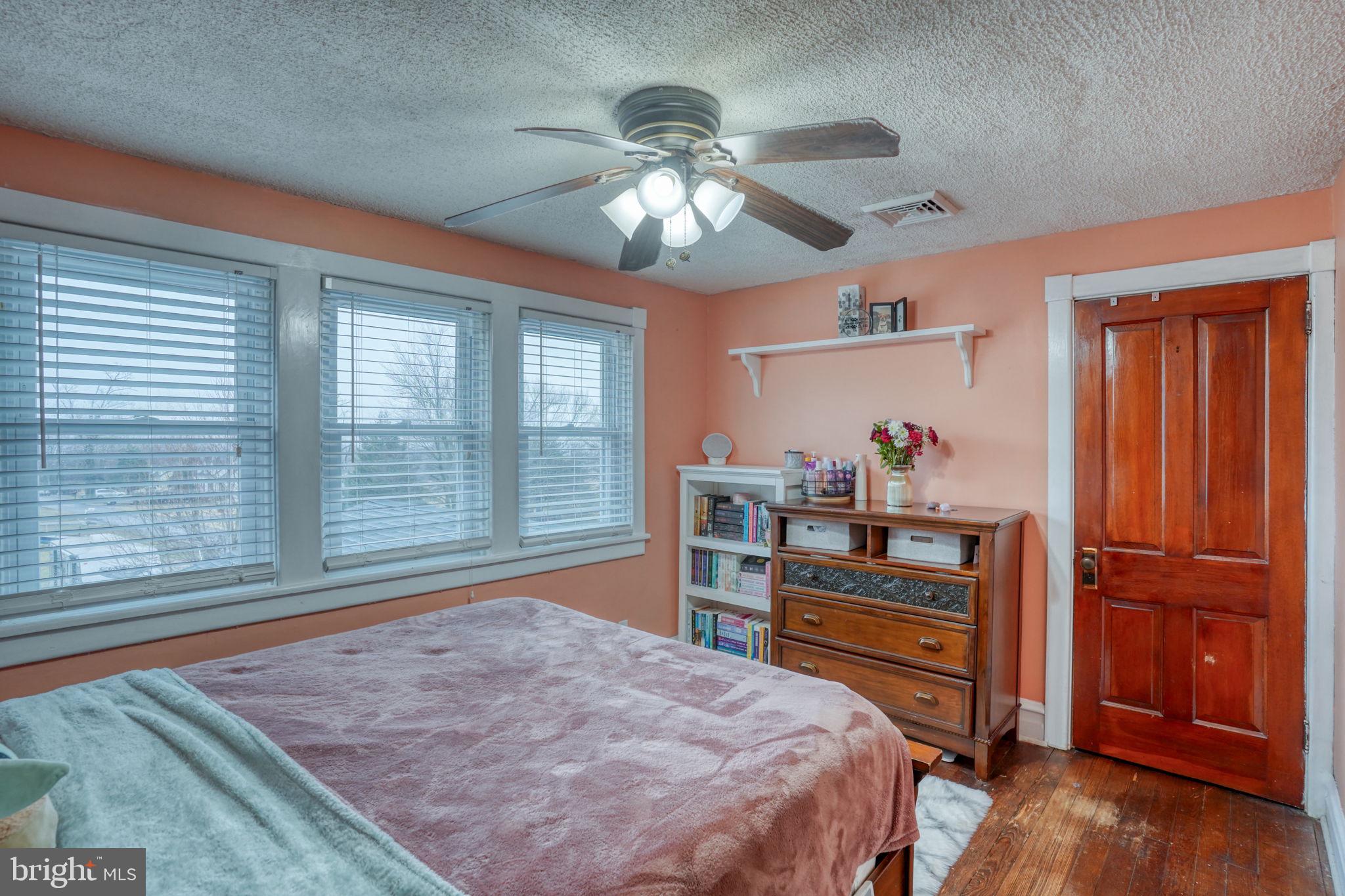7 Patterson Avenue Perryville, MD 21903 - Photo 24 of 44 a bedroom with a bed and a chandelier