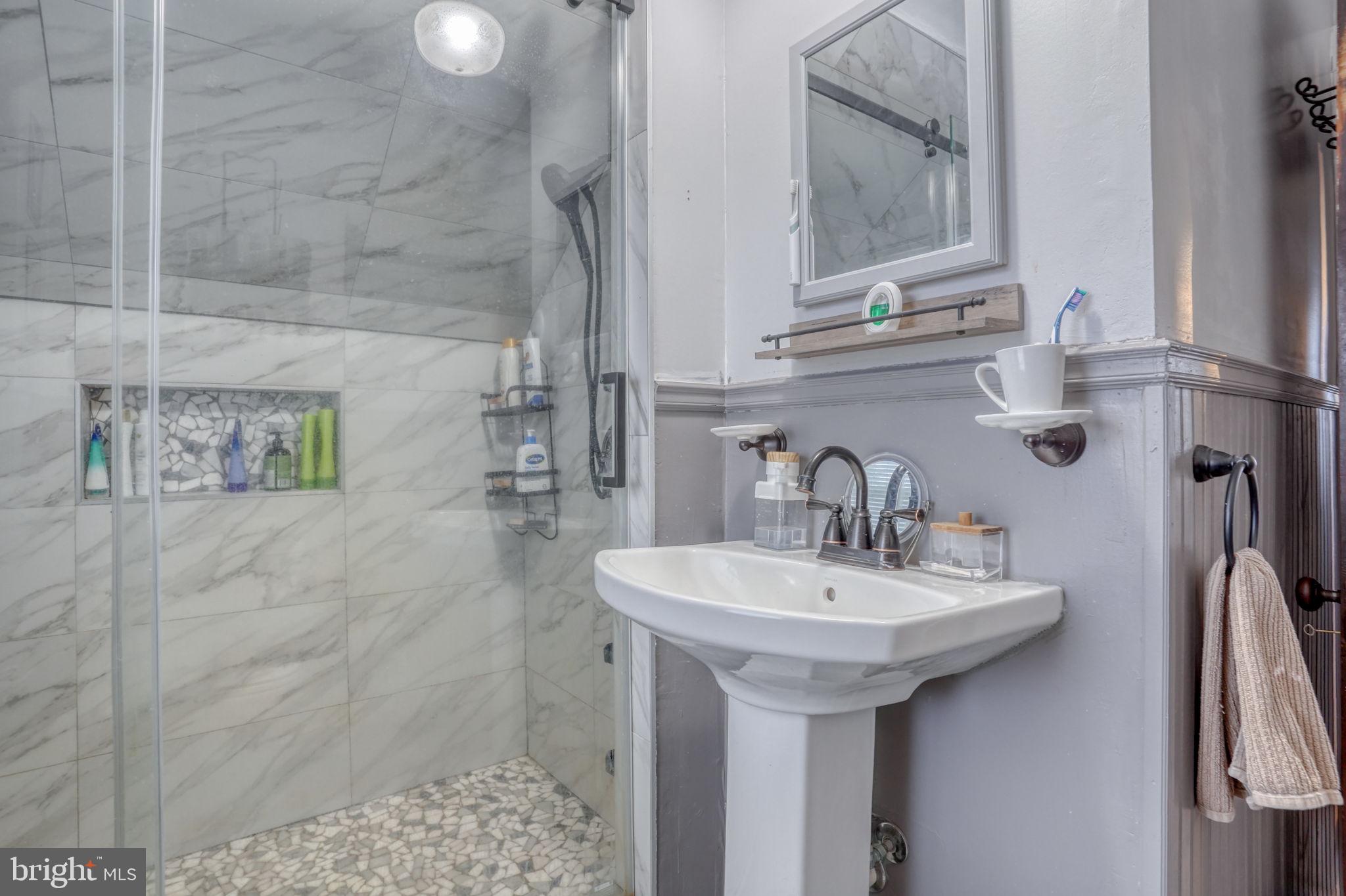 7 Patterson Avenue Perryville, MD 21903 - Photo 25 of 44 a bathroom with a sink and a mirror