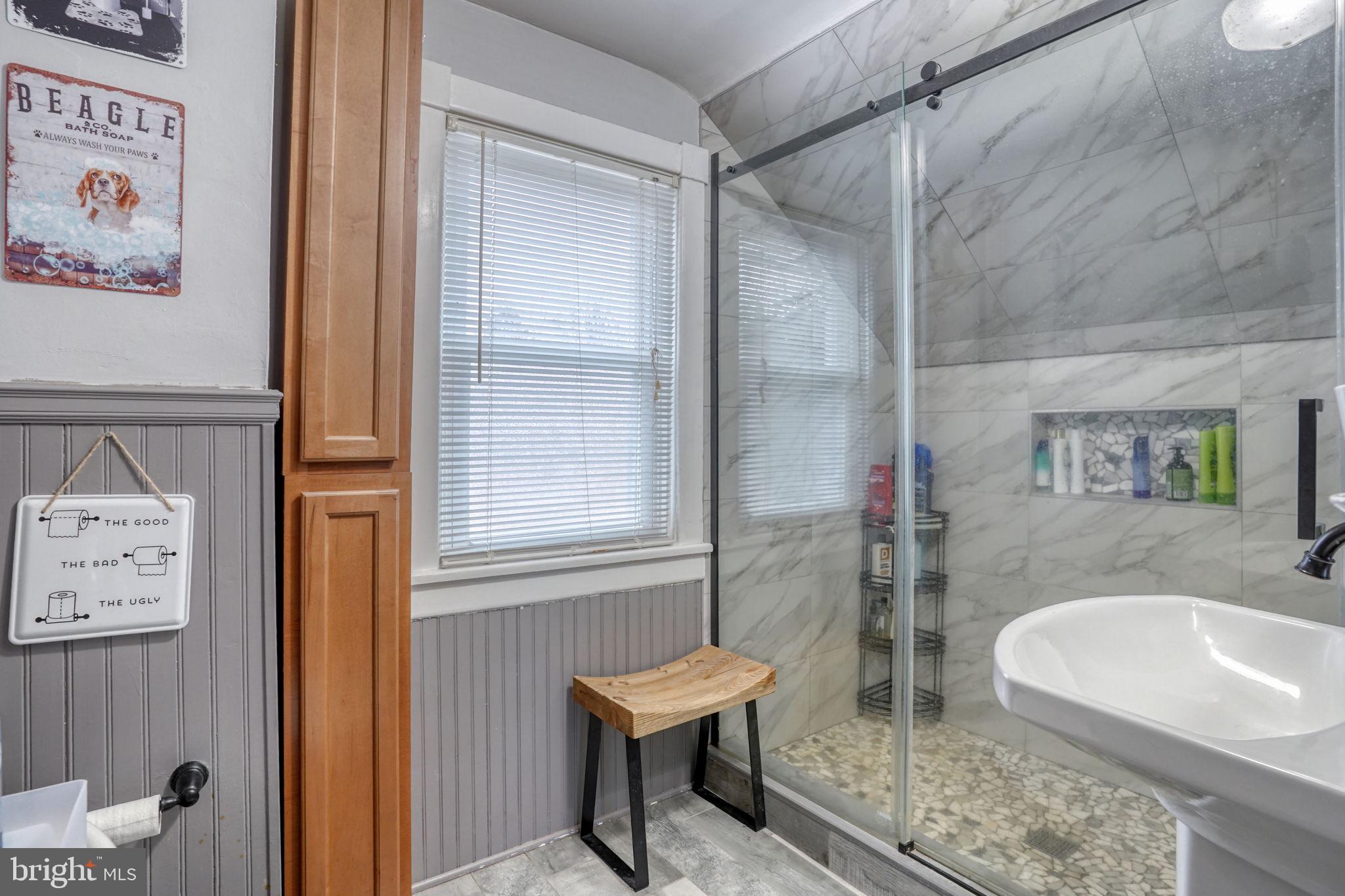 7 Patterson Avenue Perryville, MD 21903 - Photo 26 of 44 a bathroom with a granite countertop sink a mirror and shower