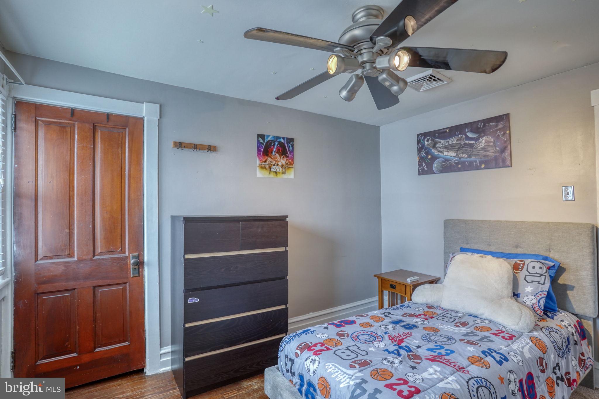 7 Patterson Avenue Perryville, MD 21903 - Photo 27 of 44 a bedroom with a bed and a chandelier