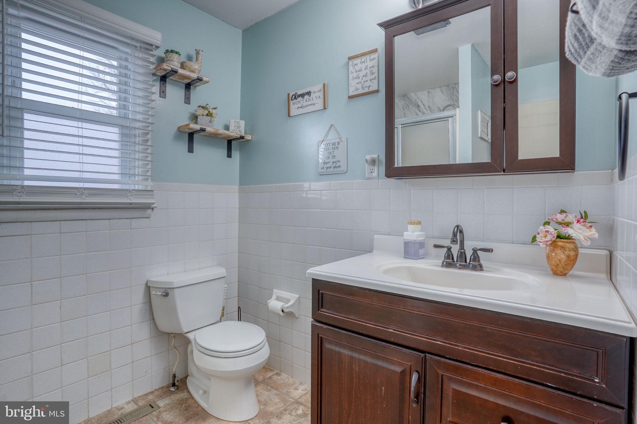 7 Patterson Avenue Perryville, MD 21903 - Photo 32 of 44 a bathroom with a sink a toilet and mirror