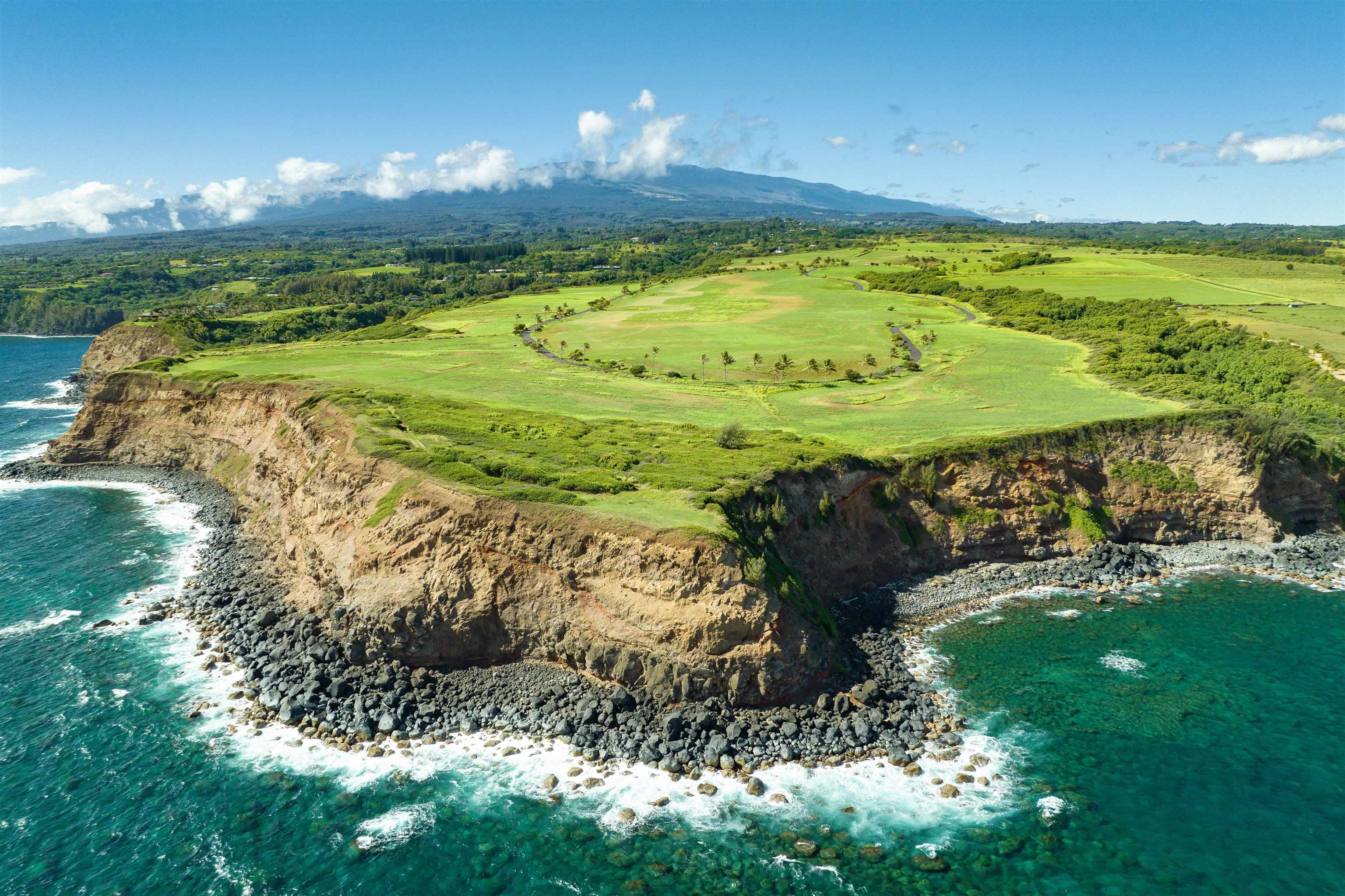 400 Kai Huki Street, Unit LOT 16 Haiku, HI 96708 - Photo 6 of 17 a view of a swimming pool of a house with a yard