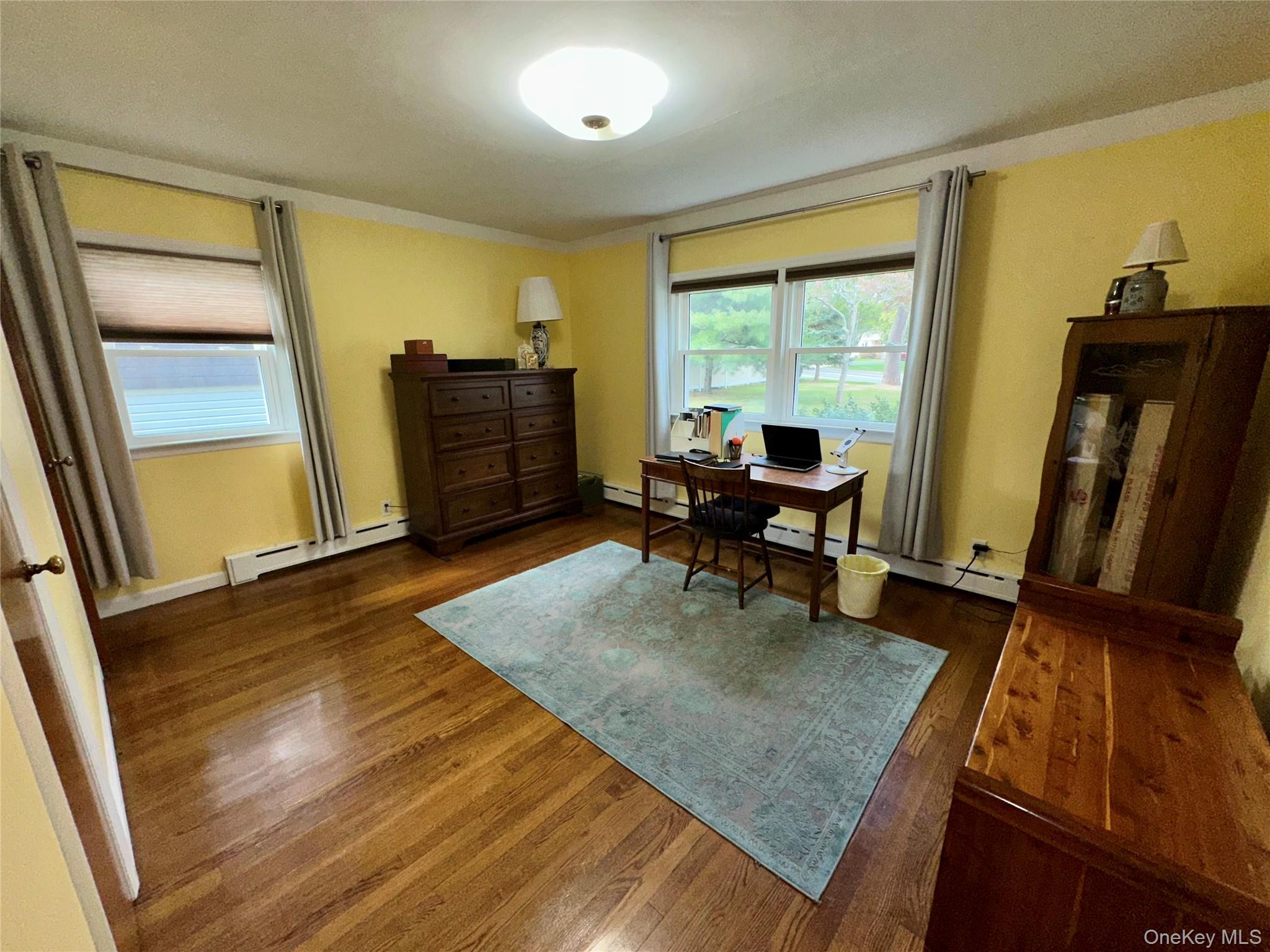 406 Moriches Road St. James, NY 11780 - Photo 11 of 28 a living room with furniture rug and wooden floor