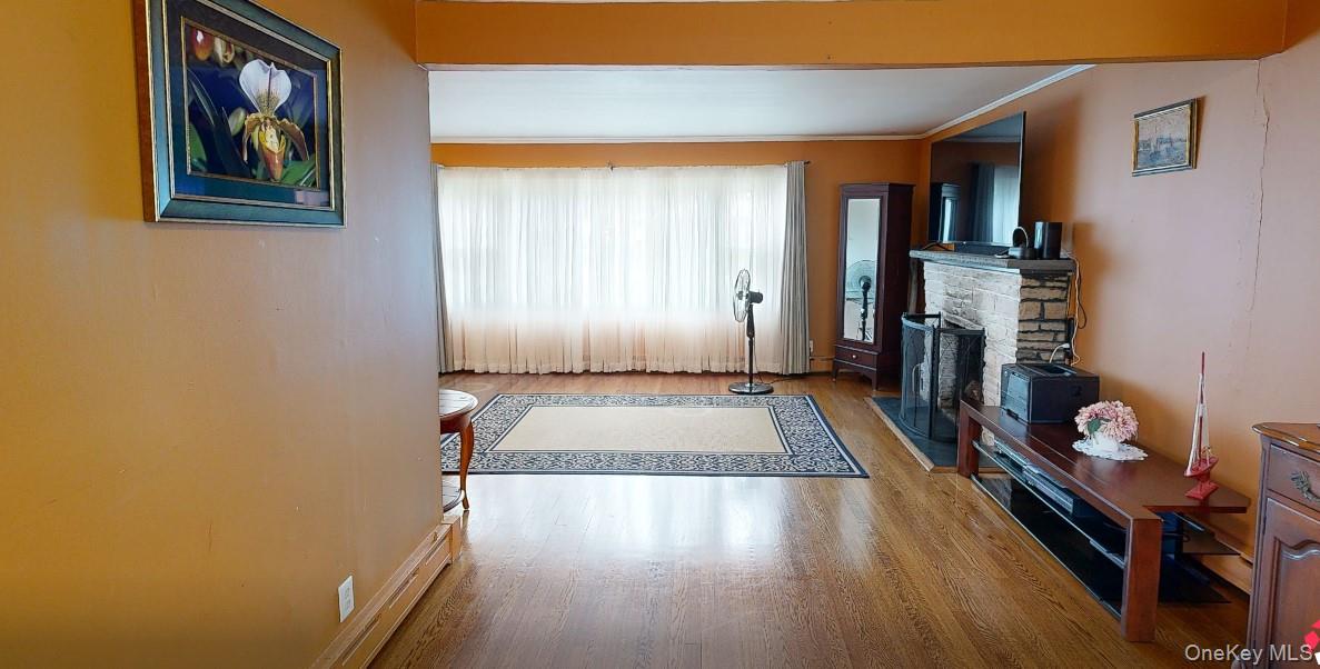406 Moriches Road St. James, NY 11780 - Photo 12 of 28 a living room with furniture fireplace and flat screen tv