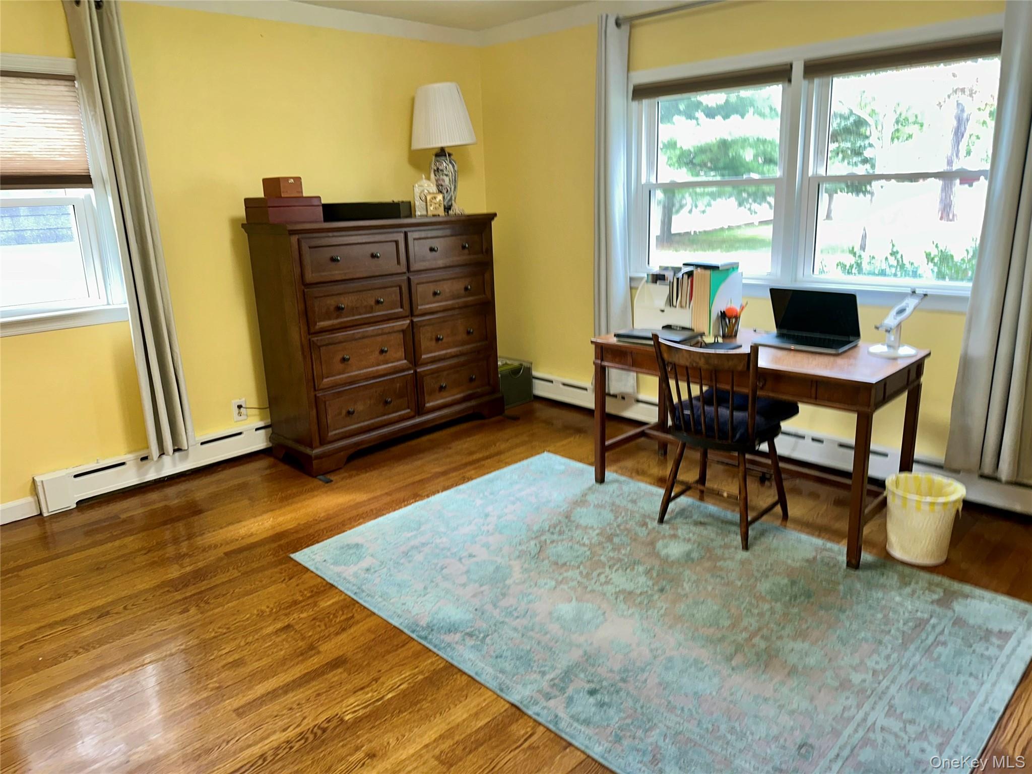 406 Moriches Road St. James, NY 11780 - Photo 13 of 28 a living room with furniture and a table