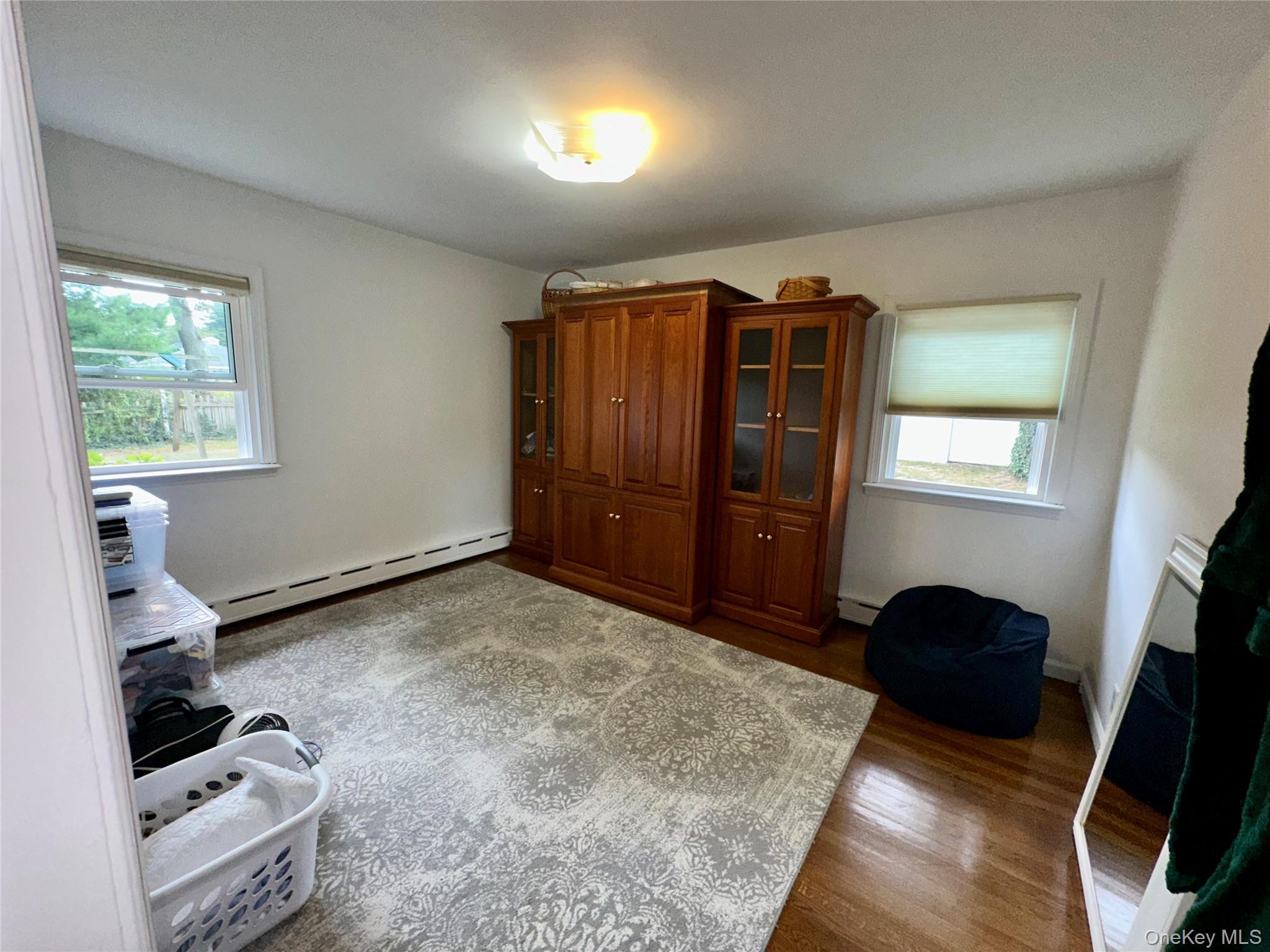 406 Moriches Road St. James, NY 11780 - Photo 15 of 28 a view of bedroom with furniture and a window