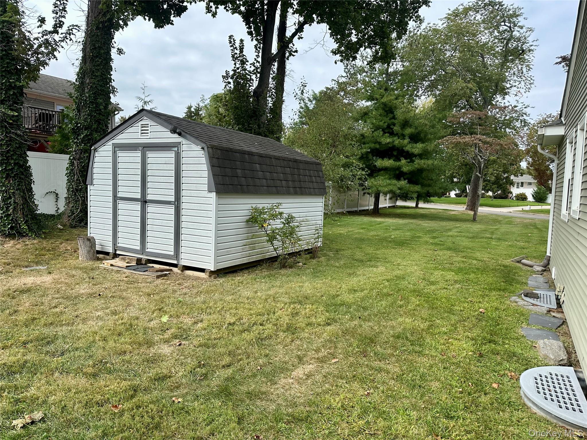 406 Moriches Road St. James, NY 11780 - Photo 27 of 28 a house view with a garden space