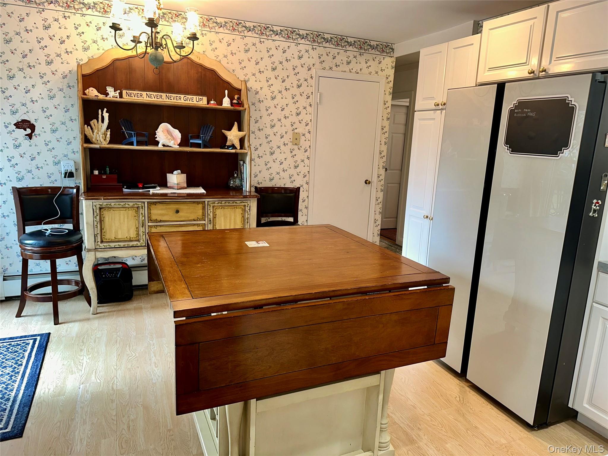 406 Moriches Road St. James, NY 11780 - Photo 3 of 28 a room with a table and chairs