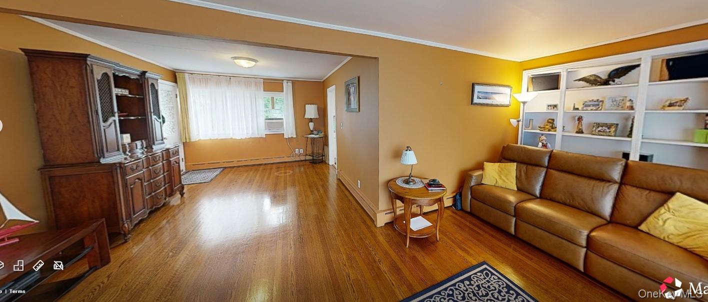 406 Moriches Road St. James, NY 11780 - Photo 5 of 28 a living room with furniture and a flat screen tv