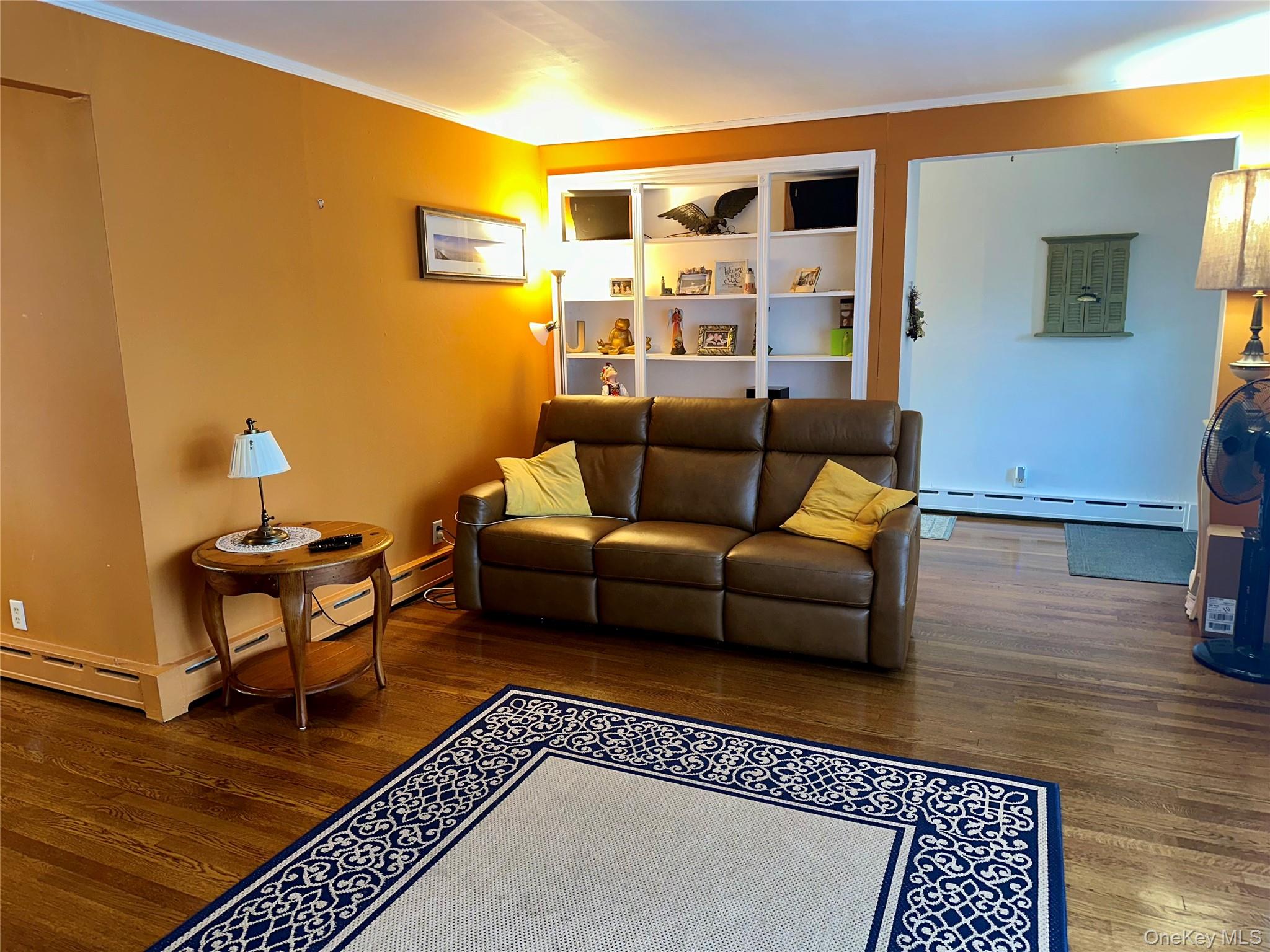 406 Moriches Road St. James, NY 11780 - Photo 6 of 28 a living room with furniture and a rug
